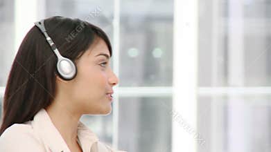 Ethnic business woman talking on headset