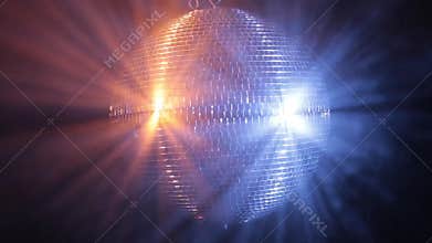 Disco mirror ball reflect very bright blue and red light