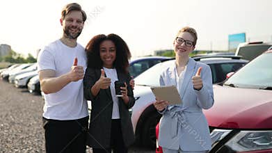 Happy Car Buyers with Salesperson