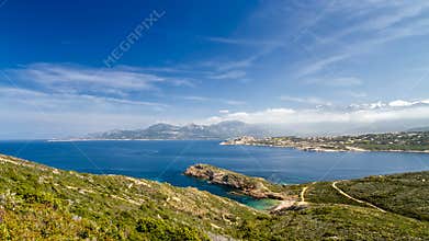 Beach, Calvi, sea and mountains from La Revellata in Corsica