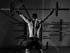 Barbell weight lifting man rear view workout gym