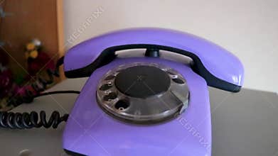 Old purple telephone with dial in Brest Belarus
