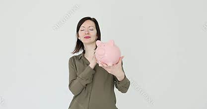 Woman and importance of saving money holding piggy bank on white background