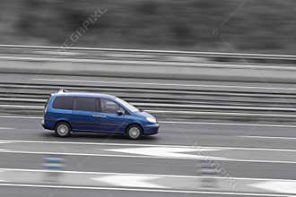passenger car on the highway in motion with a blurred background
