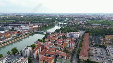 bridge over Adige River along the city of Verona on a sunny day with misty sky in Veneto, Italy