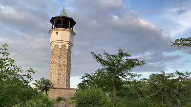 Plovdiv Clocktower: Historical Landmark in Bulgaria Amidst Lush Trees