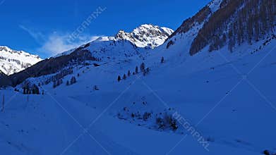 Morning view of alps covered by snow in Casere