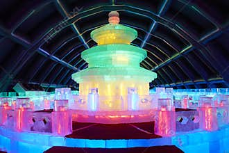 Ice sculpture of Beijing Heaven Temple, colorful lights inside, winter art