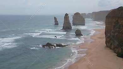Great Ocean Road and the Twelve Apostles, crashing waves, and rugged coastline.