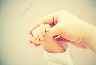 Concept of love and family. hands of mother and baby