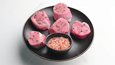 Beautifully cut raw pork medallions for tenderloin meat, waiting to absorb your favorite marinades for a flavorful feast