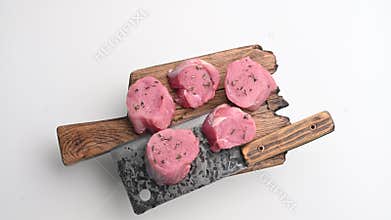 Beautifully cut raw pork medallions for tenderloin meat, waiting to absorb your favorite marinades for a flavorful feast