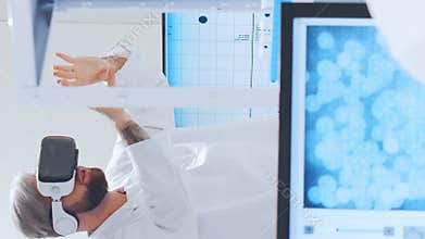 Scientific laboratory filled with various research equipment. Scientists are conducting experiments and research