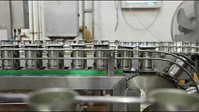 Tin can speed travel in convey belt production line in food manufacturing, Fish canned factory.