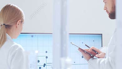 Scientific laboratory filled with various research equipment. Scientists are conducting experiments and research. Science and