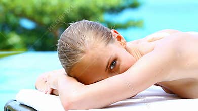 Portrait of beautiful woman on spa bed