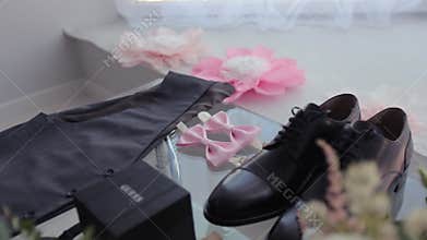 A man takes a jacket for a wedding in his hand