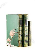 Vintage books stacked and glasses