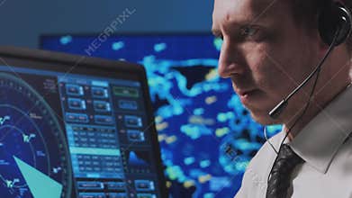 Professional air traffic controller in the control tower. Aircraft control officer works using radar, computer navigation and
