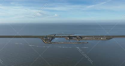 the Afsluitdijk, Breezanddijk, The Netherlands, on the former work island of Breezand, gas station, small harbour, aerial drone