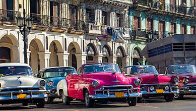 American convertible vintage cars parked on the main street in Havana Cuba