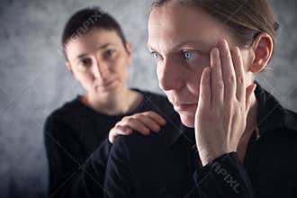 Comforting friend. Woman consoling her sad friend.