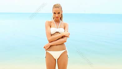 Cute woman in bikini at the seaside