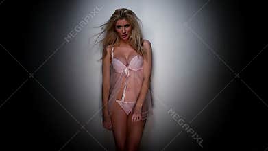 Smiling Pretty Woman in Pink Lingerie