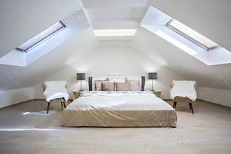 Bright attic bedroom in the apartment
