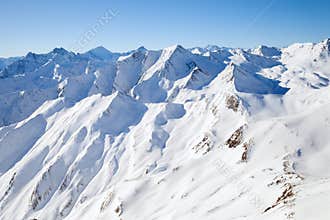 The peaks of the mountain range in winter Alps
