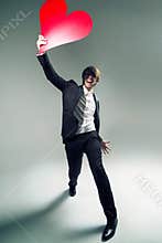 Joyful young boyfriend with a big heart