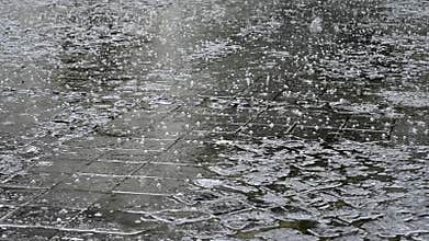 Shower of Hail on Paved Street
