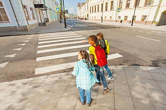 Careful children crossing street