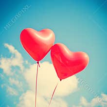 Two red Heart-shaped balloons