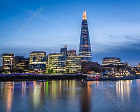 Thames River Embankment and London Skyline at Sunset