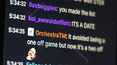 Close-up of scrolling Jerma985 live stream chat on a computer monitor with colorful usernames timestamps and emote reactions,