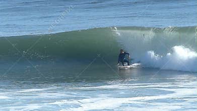 Man Surfing on a Big Wave in California in Slow Motion
