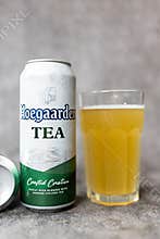 Bangkok, Thailand - May 6, 2026 : Glass of Hoegaarden TEA placed togeter with an aluminium tin Hoegaarden TEA, 500ml