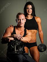 Fitness couple working out in fitness