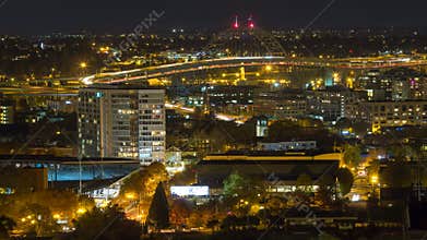 Time Lapse Movie of Long Exposure Light Trails of Fast Moving Freeway Traffic with Downtown Cityscape of Portland Oregon at Night