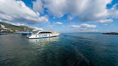 White Passenger Ferry Anchored on Calm Tropical Sea