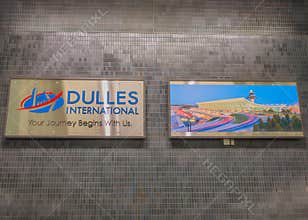 Virginia, USA - 2.2.2026 - 06.30.2026: Sign at Dulles International Airport shows airport name and welcoming message