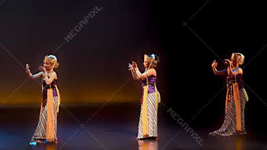 Three Traditional Female Dancers Performing Expressive Hand Gestures