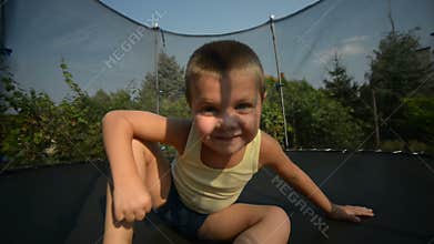 Boy enjoy jumping on trampoline