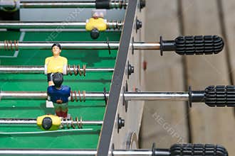 Foosball Table Handles And Miniature Soccer Players Close Up