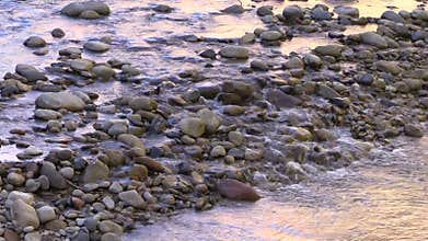 Tranquil Stream Flowing Over Rocks