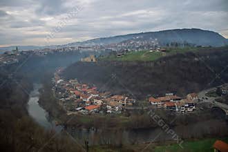 VELIKO TARNOVO, BULGARIA - MARCH 15, 2022: Scenic view of Yantra River bend and surrounding green hills