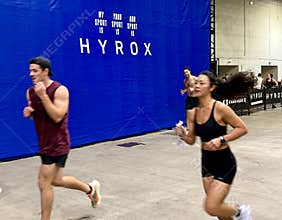 Athletes compete in Hyrox indoor fitness competition combining running and functional exercises in November 2025 in Chicago.