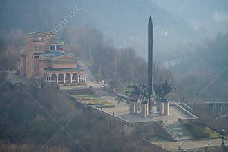 VELIKO TARNOVO, BULGARIA - MARCH 15, 2022: View of Asenevtsi Monument and Yantra River valley cityscape