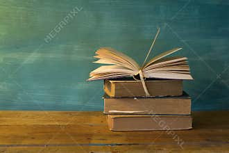 Stack of books, opened book